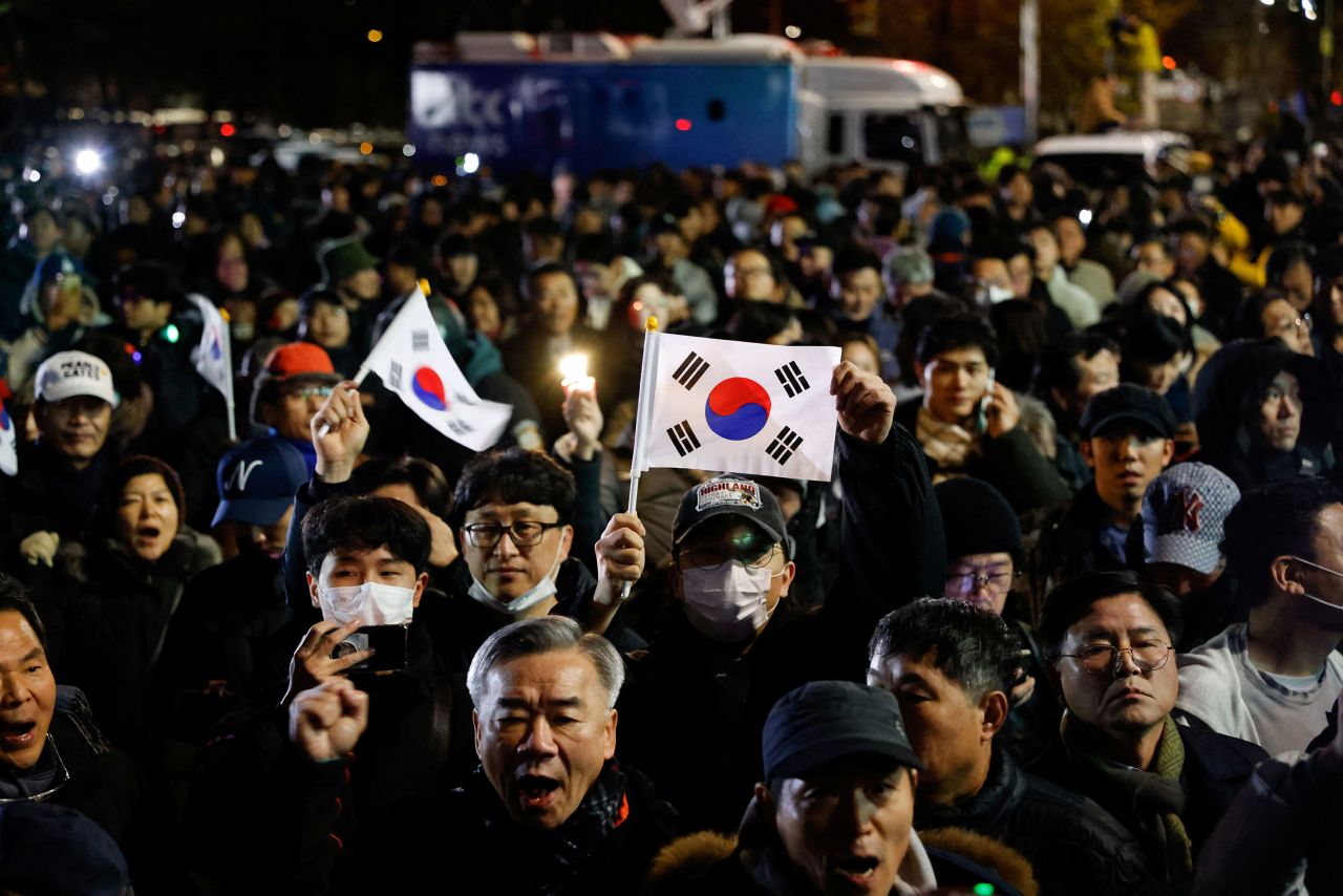 In the early hours of December 4, crowds assembled outside the National Assembly in Seoul following the declaration of martial law by South Korean President Yoon Suk Yeol. (Photo by Soo-hyeon Kim/Reuters)