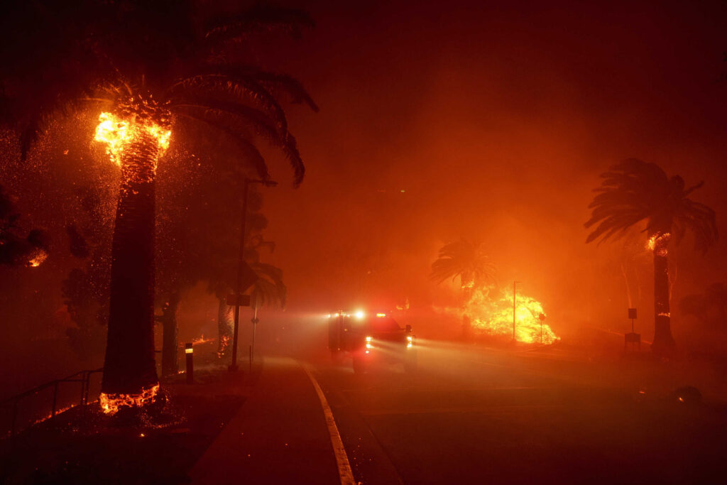 Firefighters navigate the campus of Pepperdine University. (Eric Thayer/AP)