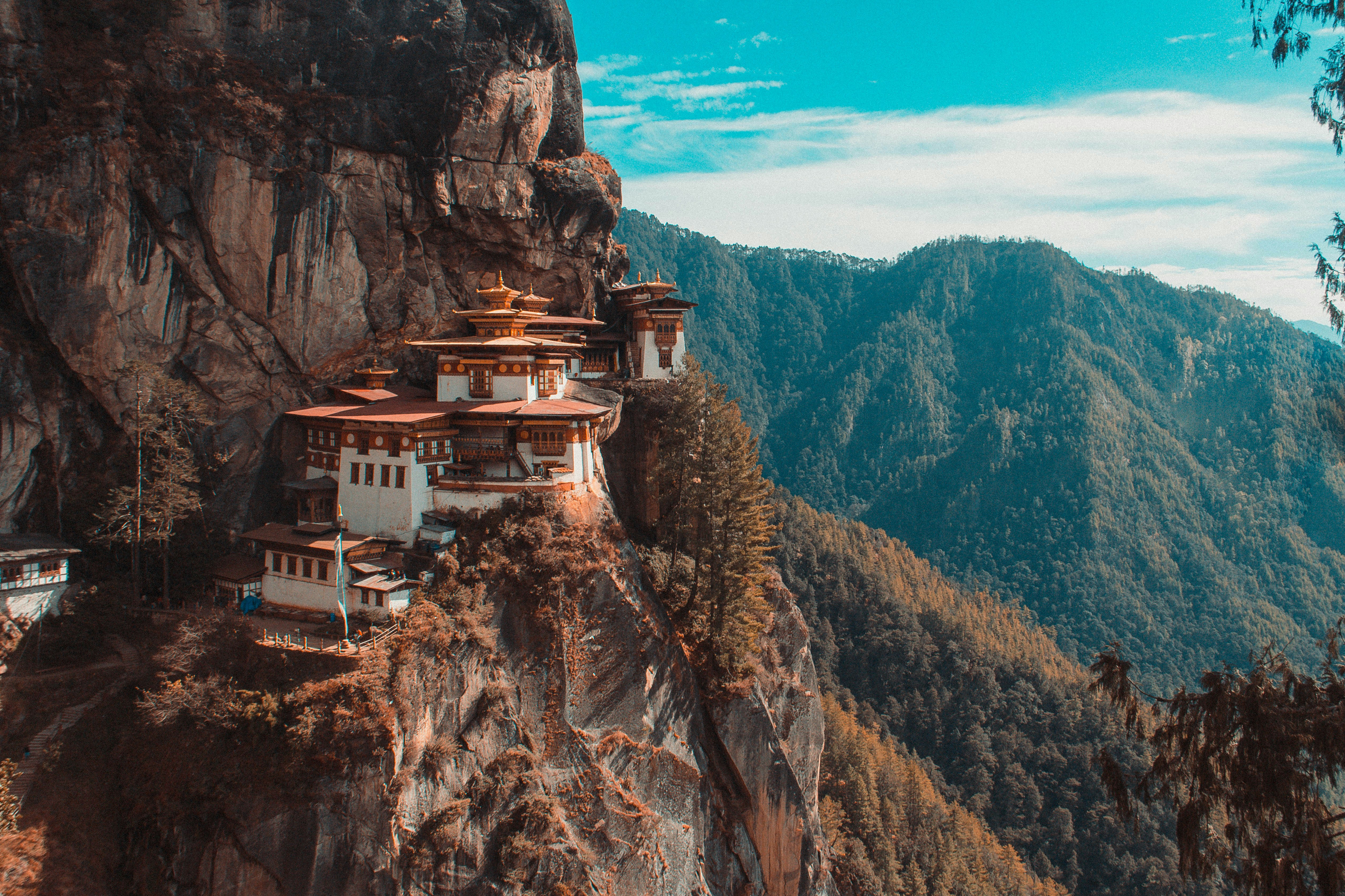 Bhutan

White, Black, and Brown House Beside Moutantiasn
