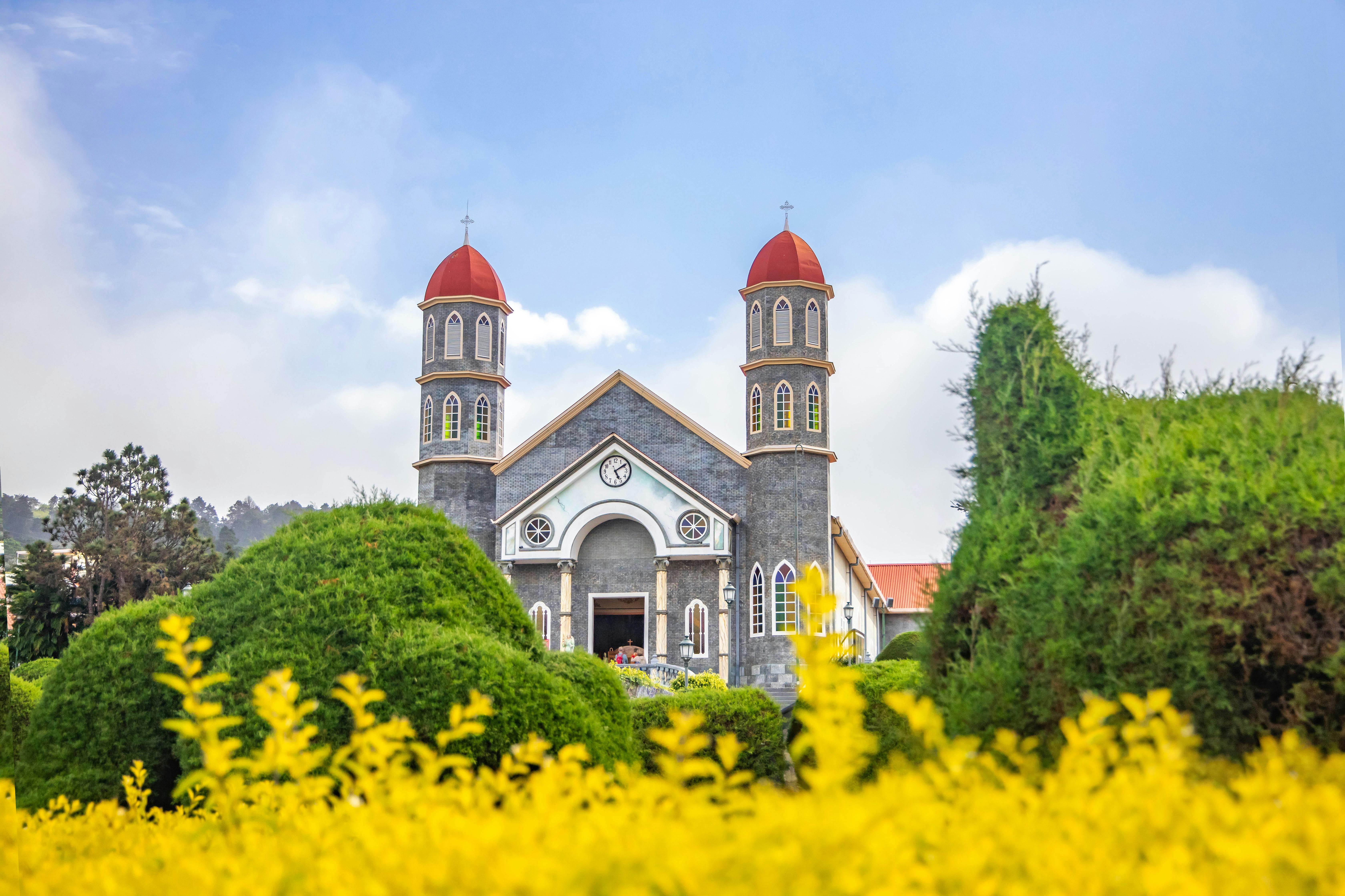 Costa Rica

Old Catholic church in well maintained garden against blue sky
