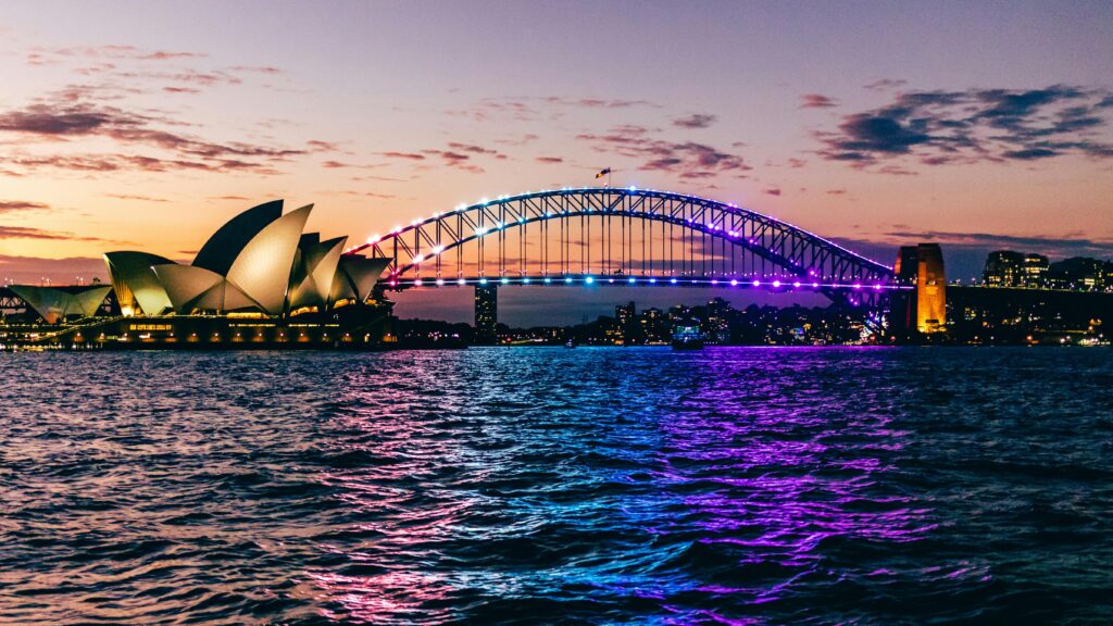 Sydney, NSW, Australia Illuminated Opera and Harbor Bridge in Sydney at Sunset