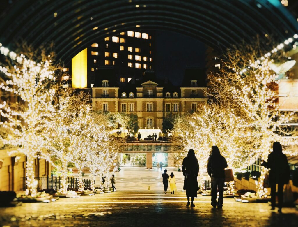 Tokyo, Tokyo, Japan Silhouettes of People Walking among Illuminated Trees at a Christmas Market in Tokyo, Japan