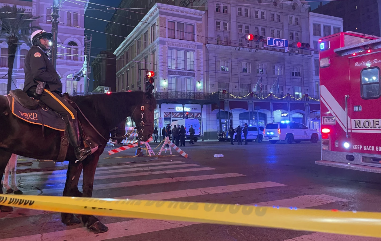 Emergency services respond after a vehicle plows into a crowd on Canal and Bourbon Street, Jan. 1, 2025. AP