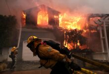 Firefighters work tirelessly to contain a house fire on Bollinger Drive in Pacific Palisades, sparked by the rapidly expanding Palisades Fire. (Photo credit: Wally Skalij / Los Angeles Times)