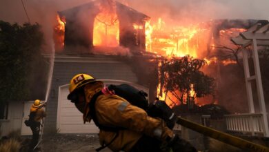 Firefighters work tirelessly to contain a house fire on Bollinger Drive in Pacific Palisades, sparked by the rapidly expanding Palisades Fire. (Photo credit: Wally Skalij / Los Angeles Times)