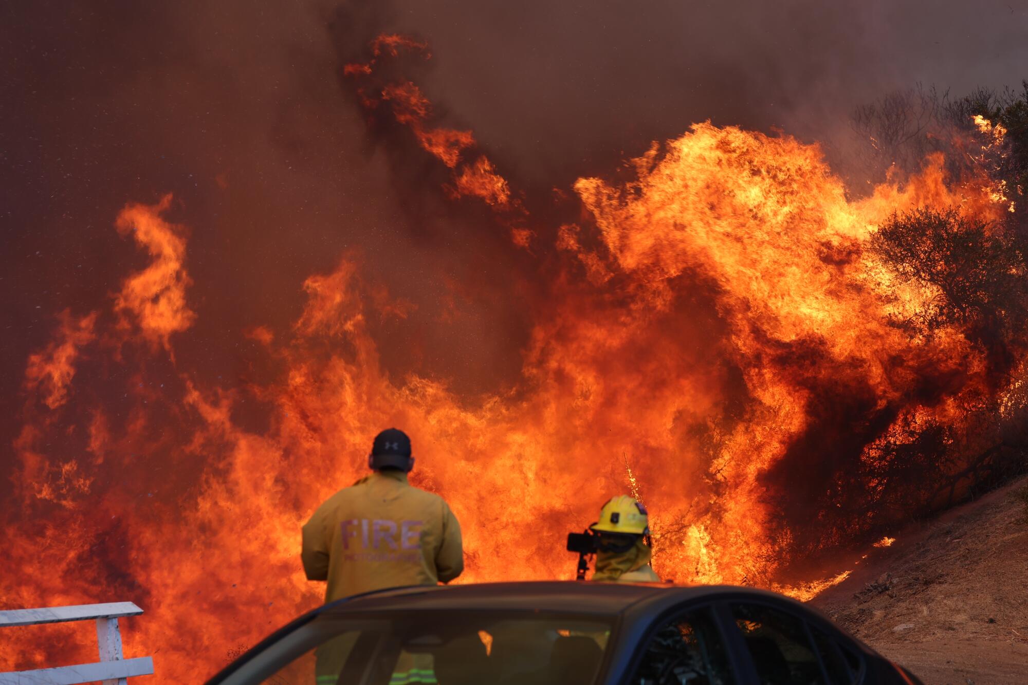 A wind-fueled wildfire tears through Pacific Palisades on Tuesday. (Photo by Brian van der Brug / Los Angeles Times)