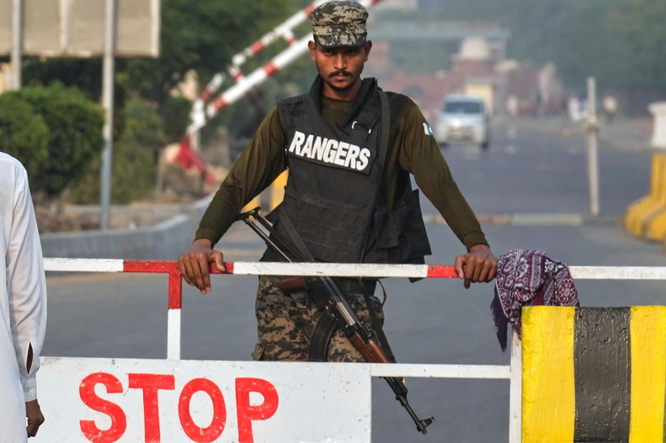 A Pakistani paramilitary soldier stands guard at a checkpoint in Wagah, the joint border crossing between Pakistan and India, near Lahore on Wednesday. AP