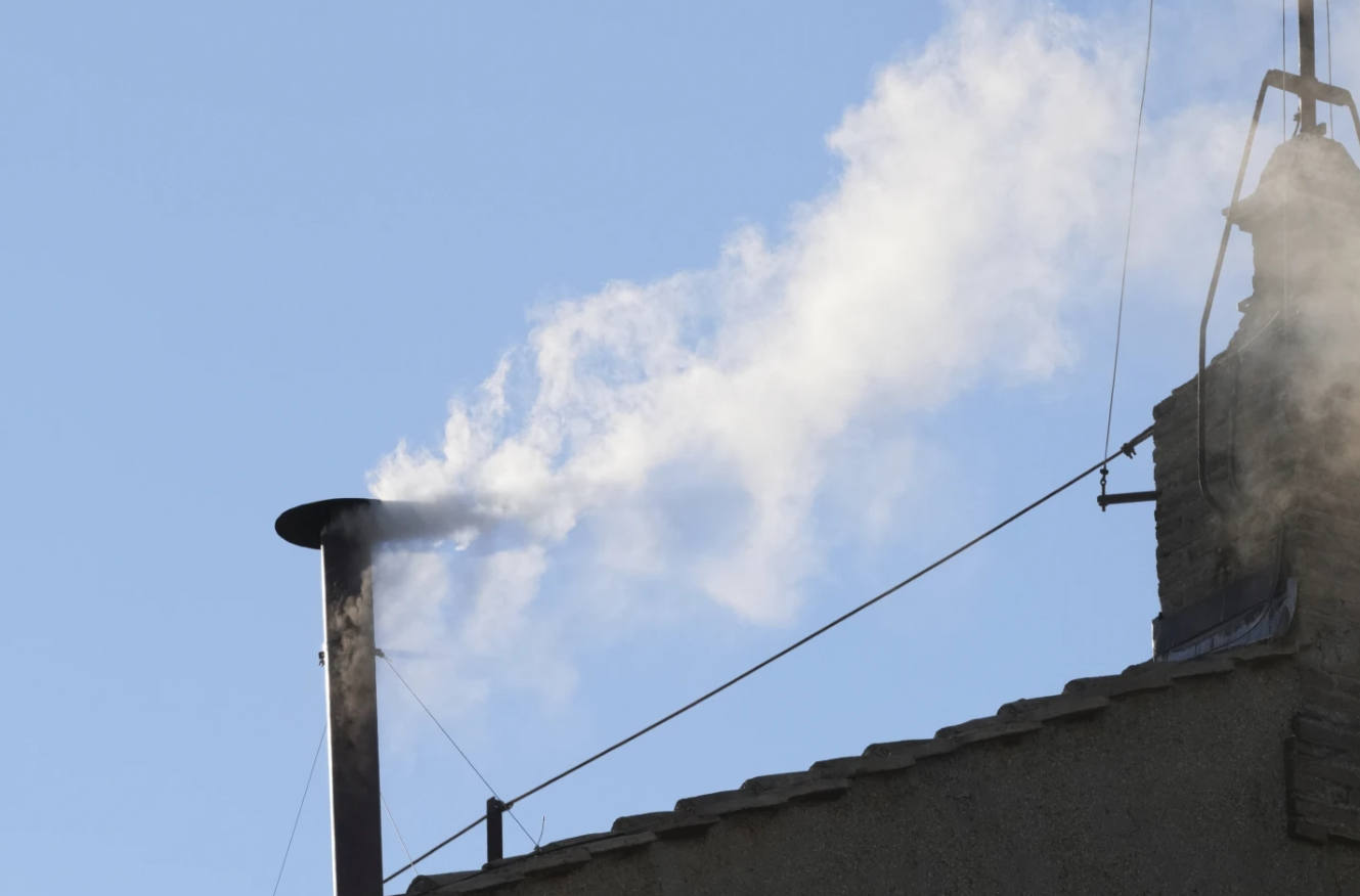 White smoke billows from the chimney of the Sistine Chapel on Thursday.