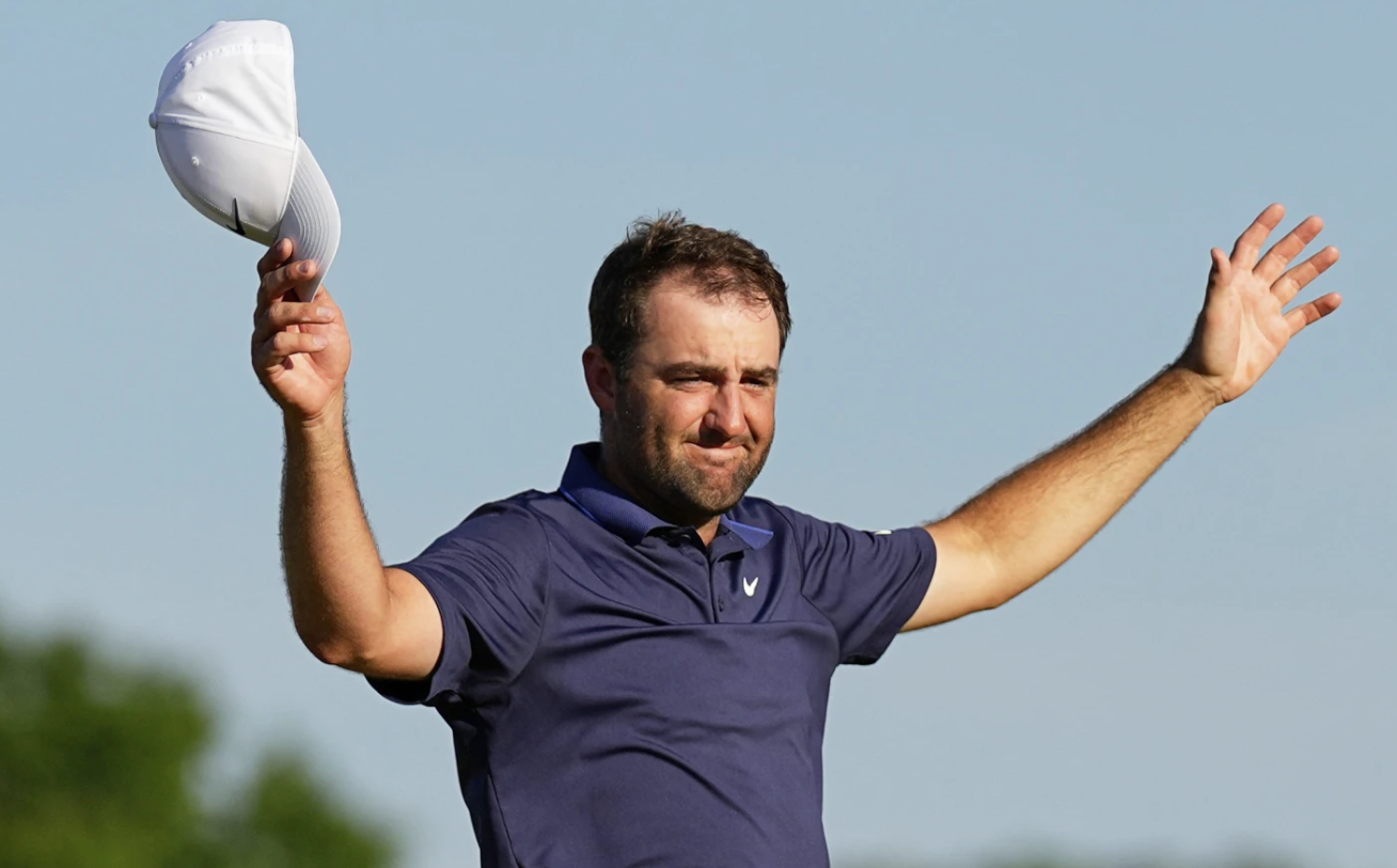 Scottie Scheffler pumps his hands in celebration after capturing his third major title at the 2025 PGA Championship at Quail Hollow Club.
