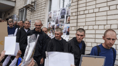Ukrainian servicemen are welcomed back after being exchanged for Russian soldiers