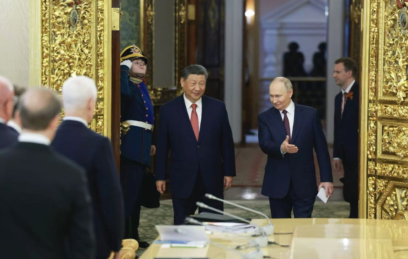 Chinese President Xi Jinping and Russian President Vladimir Putin enter the venue of their talks at the Kremlin in Moscow, Russia, on May 8, 2025