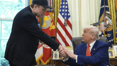 Donald Trump and Elon Musk shaking hands in the Oval Office during a press conference on May 30, 2025, in Washington, D.C.