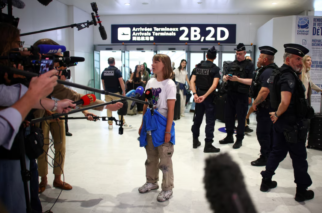 Greta Thunberg speaks to journalists at Paris airport after being deported from Israel following her detention aboard the Gaza-bound yacht Madleen on June 10, 2025.