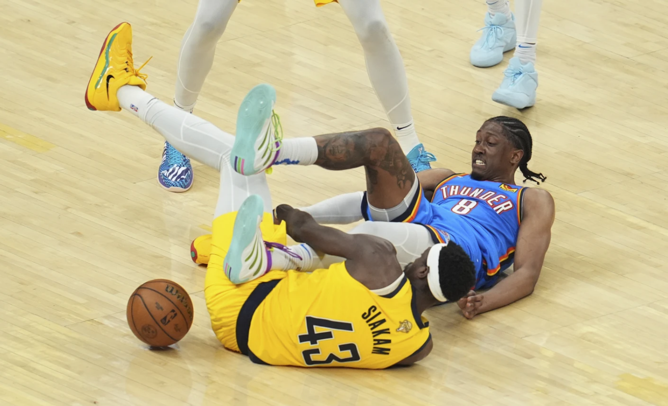 Indiana Pacers’ Pascal Siakam (43) and Thunder’s Jalen Williams (8) fight for the ball in the second half of Game 3 of the NBA Finals, June 11, 2025, Indianapolis. AP
