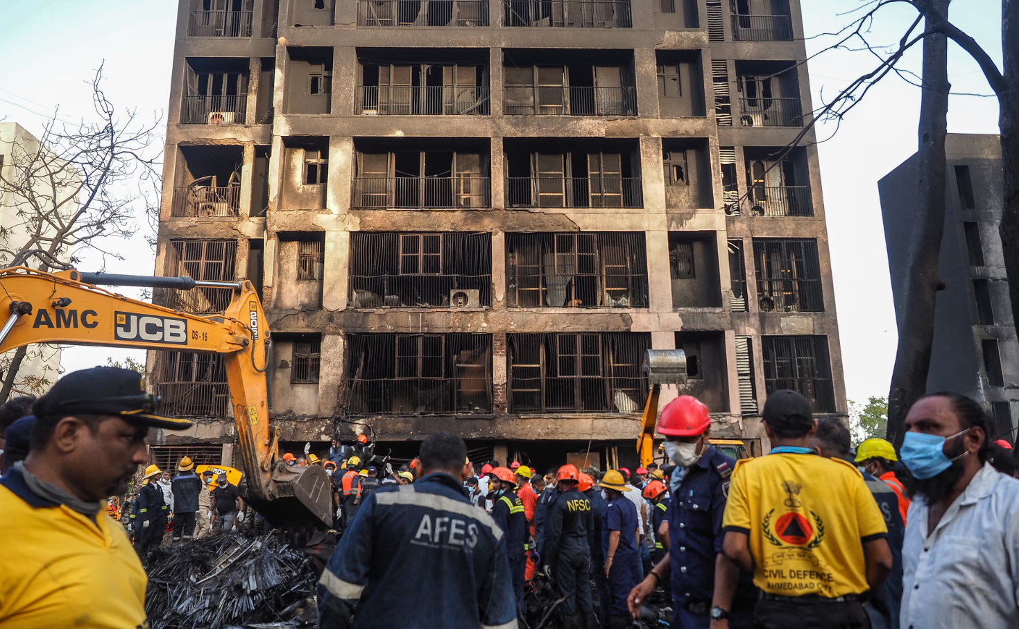 Rescue officials work at the site where Air India flight 171 crashed in a residential area near the airport in Ahmedabad. Getty Images