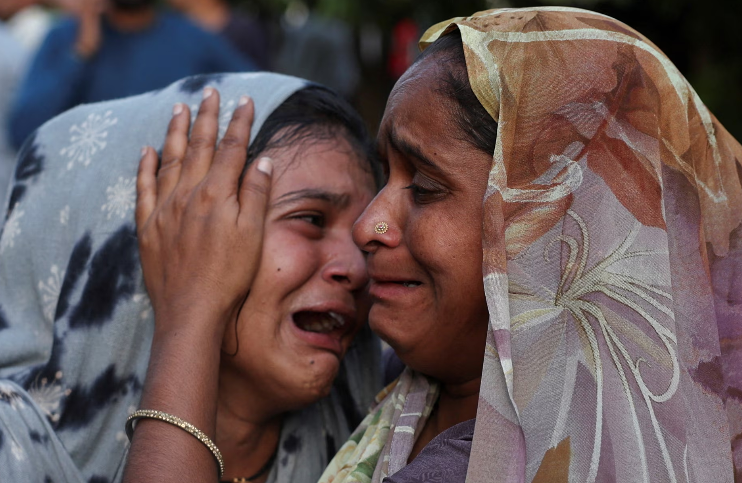 Dabu Patni cries upon hearing the news of her brother Akash Patni, who died in the crash. Reuters